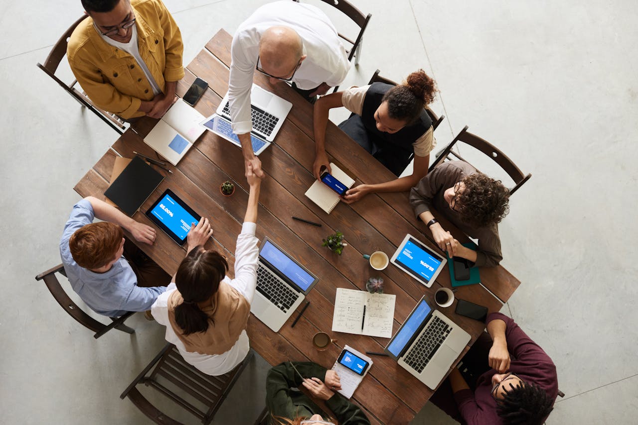a team of individuals sitting around a table